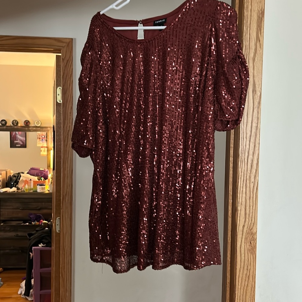 Size one towards sparkly, maroon red shirt